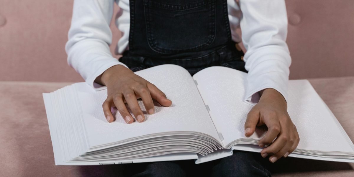 A happy child engrossed in a book, representing Goosebumps' power to engage reluctant readers.