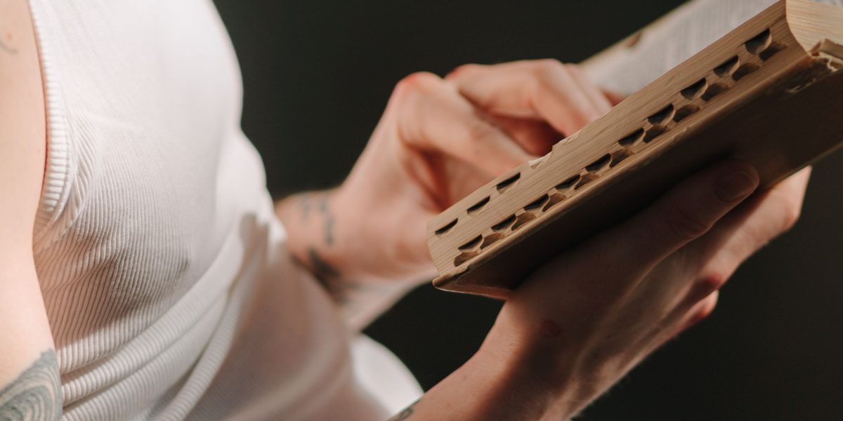 A person deeply absorbed in reading a book, reflecting the intense emotional connection readers have with the Bridgerton series.