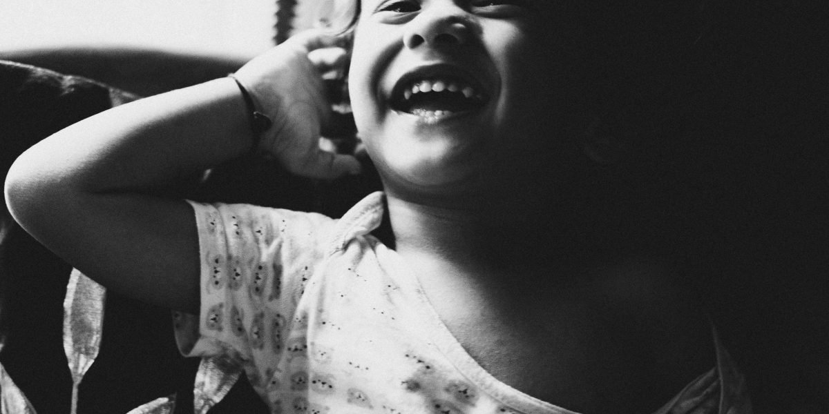 A child looking determined and kind, embodying the resilience and imaginative spirit of characters like Sara Crewe.