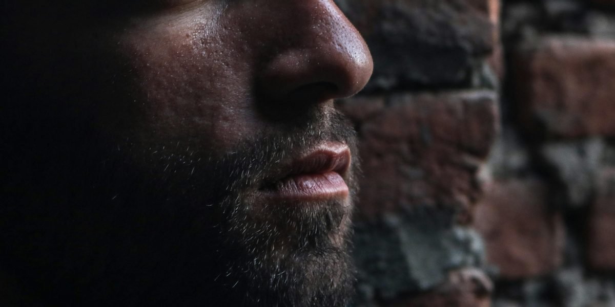 A person reflecting deeply, embodying the experience of engaging with powerful and thought-provoking narratives.