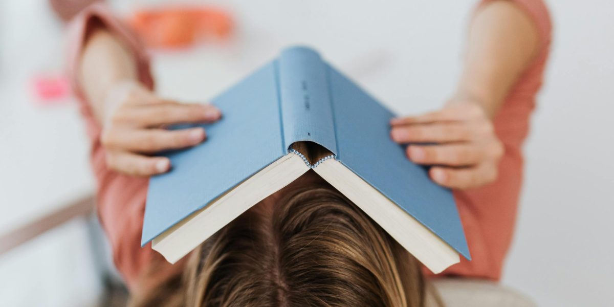 A reader feeling overwhelmed by the vast number of classic literature titles available.